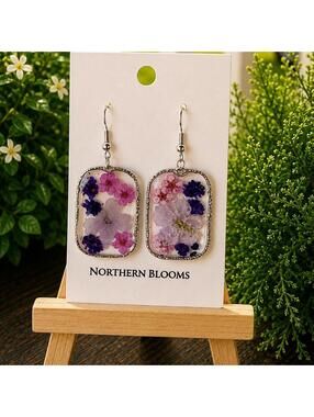 Pink and purple pressed flowers in silver rectangular setting